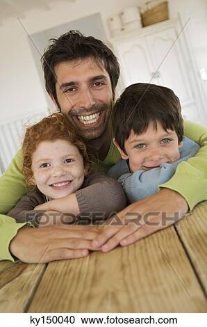 Father and 2 children smiling for the camera View Large Photo Image Stock Image - Father and 2 children smiling for the camera. Fotosearch
