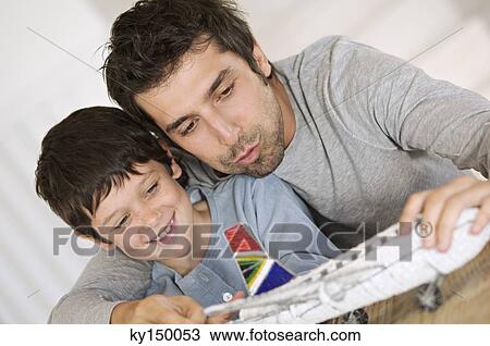 Father and son playing with model aeroplane View Large Photo Image Stock Image - Father and son playing with model aeroplane. Fotosearch