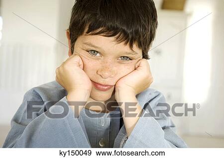 Portrait of little boy with hands on cheeks View Large Photo Image Stock Photo - Portrait of little boy with hands on cheeks. Fotosearch