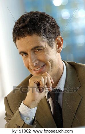 Businessman smiling, close-up View Large Photo Image Stock Image - Businessman smiling, close-up. Fotosearch