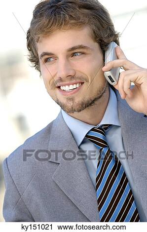 Businessman using mobile phone, smiling View Large Photo Image Stock Image - Businessman using mobile phone, smiling. Fotosearch