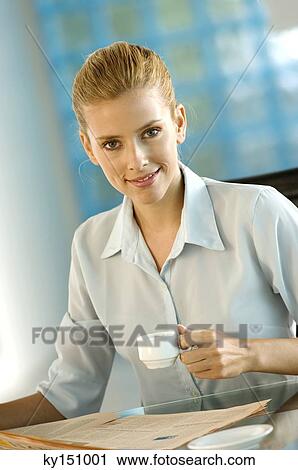 Businesswoman holding coffee cup, portrait View Large Photo Image Stock Image - Businesswoman holding coffee cup, portrait. Fotosearch