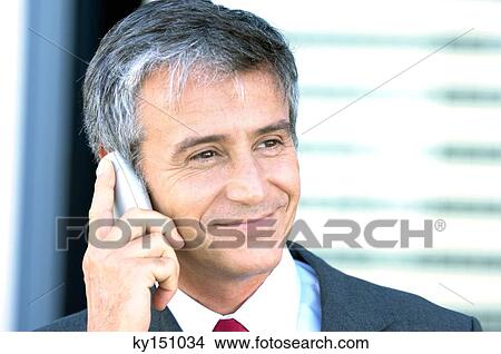 Mature businessman using mobile phone, close-up View Large Photo Image Picture - Mature businessman using mobile phone, close-up. Fotosearch