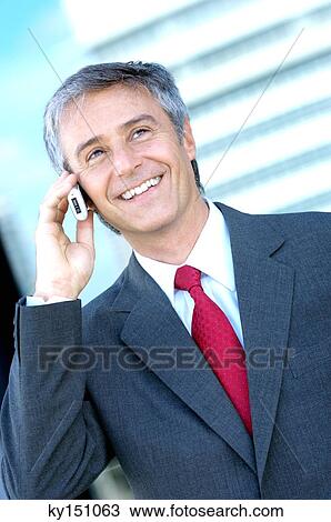 Mature businessman using mobile phone View Large Photo Image Stock Image - Mature businessman using mobile phone. Fotosearch