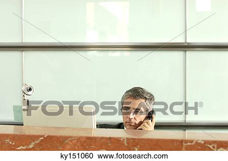 Mature businessman using telephone View Large Photo Image Stock Image - Mature businessman using telephone. Fotosearch