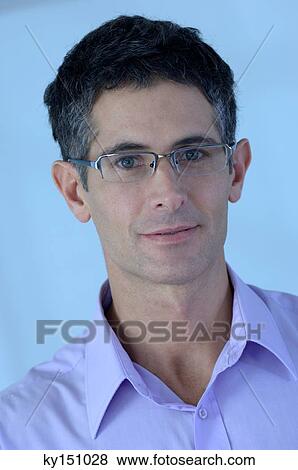 Mid adult man smiling, portrait View Large Photo Image Stock Photo - Mid adult man smiling, portrait. Fotosearch