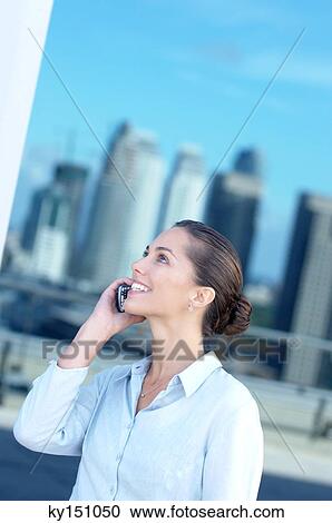 Young businesswoman using mobile phone View Large Photo Image Stock Image - Young businesswoman using mobile phone. Fotosearch