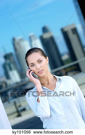 Young businesswoman using mobile phone, portrait View Large Photo Image Stock Photograph - Young businesswoman using mobile phone, portrait. Fotosearch