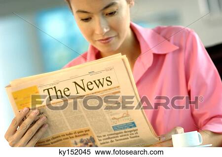 Businesswoman reading newspaper View Large Photo Image Stock Photography - Businesswoman reading newspaper. Fotosearch