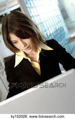 Businesswoman using laptop View Large Photo Image Stock Photograph - Businesswoman using laptop. Fotosearch