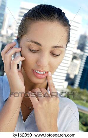 Businesswoman using mobile phone View Large Photo Image Stock Image - Businesswoman using mobile phone. Fotosearch