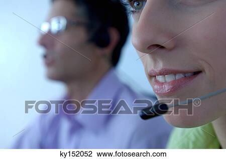Businesswoman wearing headset in office View Large Photo Image Stock Image - Businesswoman wearing headset in office. Fotosearch