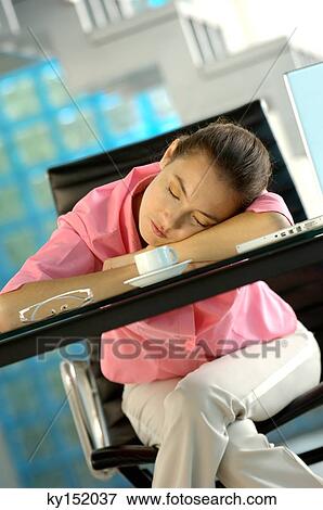 Young businesswoman sleeping on glass tabletop View Large Photo Image Stock Photo - Young businesswoman sleeping on glass tabletop. Fotosearch