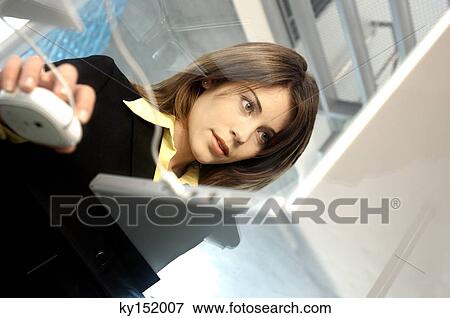 Young businesswoman using laptop View Large Photo Image Stock Photo - Young businesswoman using laptop. Fotosearch
