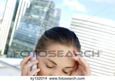 Young businesswoman using mobile phone View Large Photo Image Picture - Young businesswoman using mobile phone. Fotosearch