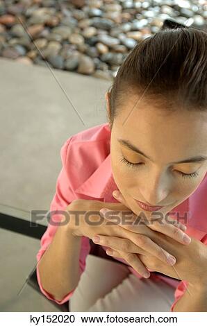 Young woman with eyes closed, high angle view View Large Photo Image Stock Image - Young woman with eyes closed, high angle view. Fotosearch