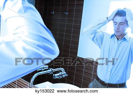 Reflection of mid adult man standing in front of mirror in washroom View Large Photo Image Stock Image - Reflection of mid adult man standing in front of mirror in washroom. Fotosearch