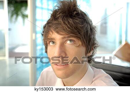 Young businessman looking up View Large Photo Image Stock Image - Young businessman looking up. Fotosearch