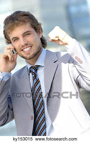 Young businessman using mobile phone, portrait View Large Photo Image Stock Photography - Young businessman using mobile phone, portrait. Fotosearch