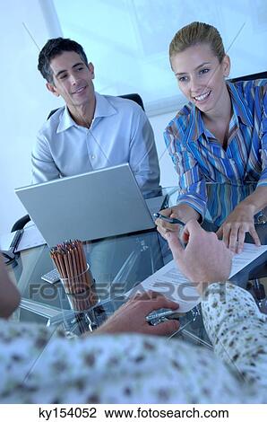 Business people smiling in office, rear view View Large Photo Image Stock Image - Business people smiling in office, rear view. Fotosearch