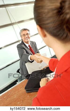 Businessman and businesswoman shaking hands View Large Photo Image Stock Image - Businessman and businesswoman shaking hands. Fotosearch