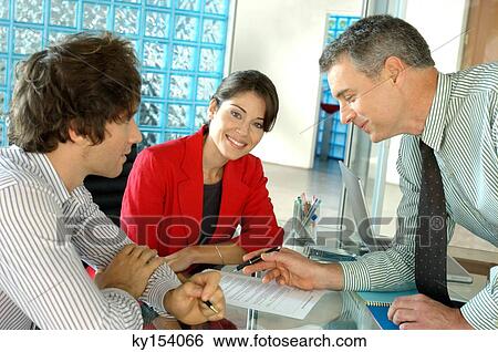 Businessmen and businesswoman in office, smiling View Large Photo Image Stock Photograph - Businessmen and businesswoman in office, smiling. Fotosearch
