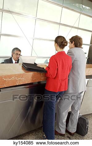 Businessmen and businesswoman standing in office View Large Photo Image Stock Photography - Businessmen and businesswoman standing in office. Fotosearch