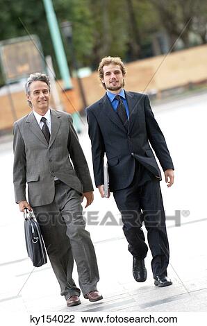Businessmen walking on street View Large Photo Image Stock Image - Businessmen walking on street. Fotosearch