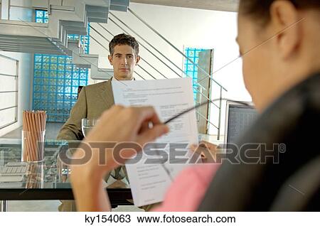 Stock Image - Businesswoman conducting interview in office. Fotosearch
