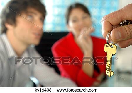 Car dealer handing keys to customer View Large Photo Image Stock Image - Car dealer handing keys to customer. Fotosearch