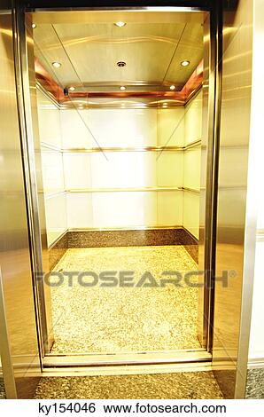 Illuminated vacant elevator View Large Photo Image Stock Photograph - Illuminated vacant elevator. Fotosearch