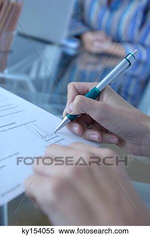 Person signing on document, close-up View Large Photo Image Stock Photography - Person signing on document, close-up. Fotosearch