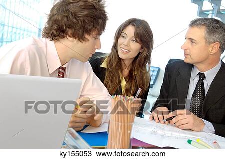 Business people discussing in office, smiling View Large Photo Image Stock Image - Business people discussing in office, smiling. Fotosearch