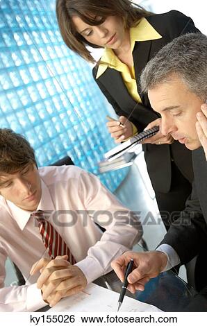 Business people discussing in office View Large Photo Image Stock Photograph - Business people discussing in office. Fotosearch