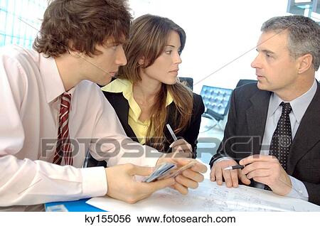 Business people discussing in office View Large Photo Image Stock Photograph - Business people discussing in office. Fotosearch