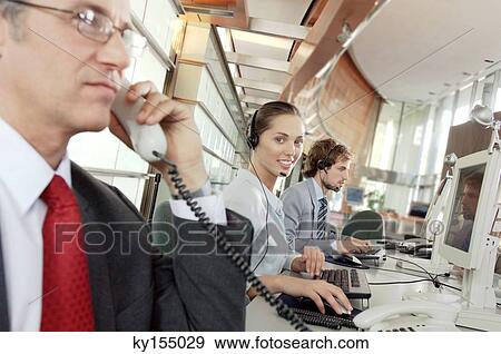 Stock Photo - Business people in office. Fotosearch