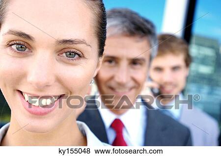 Business people in row, smiling, portrait View Large Photo Image Stock Photo - Business people in row, smiling, portrait. Fotosearch