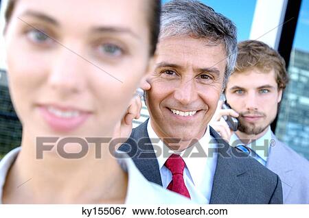 Business people in row, smiling, portrait View Large Photo Image Stock Photo - Business people in row, smiling, portrait. Fotosearch