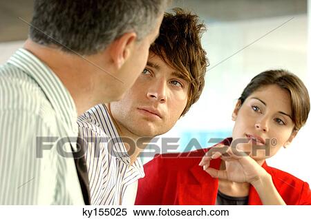 Stock Photography - Business people looking at each other. Fotosearch