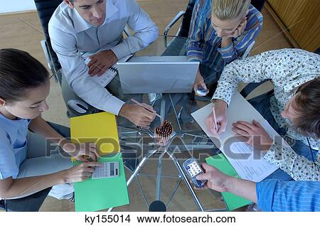 Business people sitting in office, high angle view View Large Photo Image Picture - Business people sitting in office, high angle view. Fotosearch