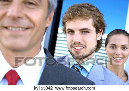Stock Image - Business people smiling, portrait. Fotosearch
