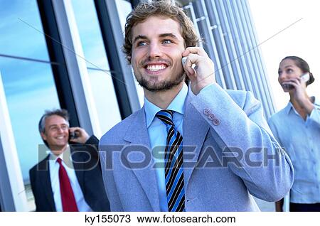 Business people using mobile phones, smiling View Large Photo Image Stock Image - Business people using mobile phones, smiling. Fotosearch