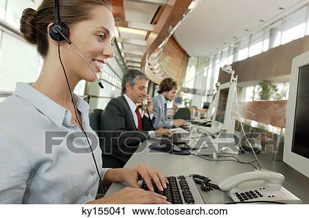Business people working in office, smiling View Large Photo Image Stock Image - Business people working in office, smiling. Fotosearch