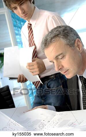 Businesspeople working in office View Large Photo Image Stock Photography - Businesspeople working in office. Fotosearch