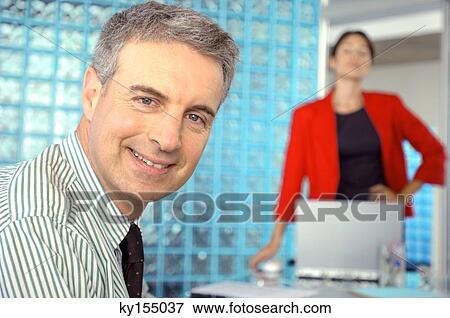 Stock Photo - Mature businessman smiling. Fotosearch
