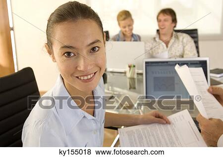 Stock Photo - Young woman smiling, portrait. Fotosearch