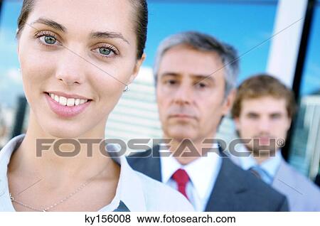 Business people standing in row, smiling, portrait View Large Photo Image Stock Photo - Business people standing in row, smiling, portrait. Fotosearch