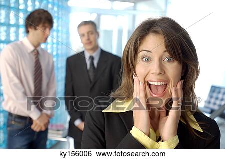Businesswoman screaming with colleagues in background View Large Photo Image Stock Photograph - Businesswoman screaming with colleagues in background. Fotosearch