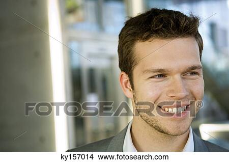 Picture - Close-up of a businessman smiling. Fotosearch