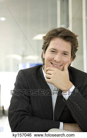 Portrait of a businessman smiling View Large Photo Image Stock Photograph - Portrait of a businessman smiling. Fotosearch